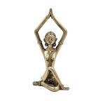 Bronze statue of a person in a yoga pose on a white background