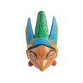 Colorful mask with blue and green feathers on a white background