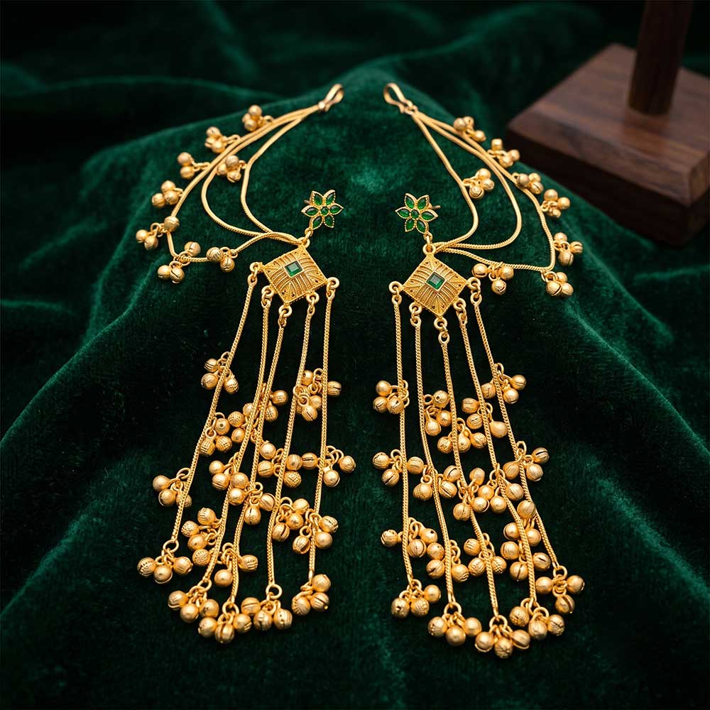 Side angle view of the multi-strand hanging ghungroo bells and hair chain extensions of the DI gold plated bridal earrings