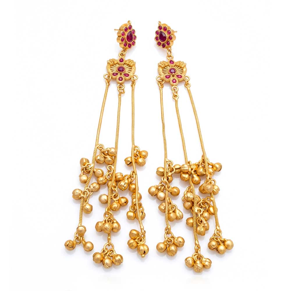 Front view of ornate DI gold plated Jhumka earrings with red ruby stones and dangling bell tassels