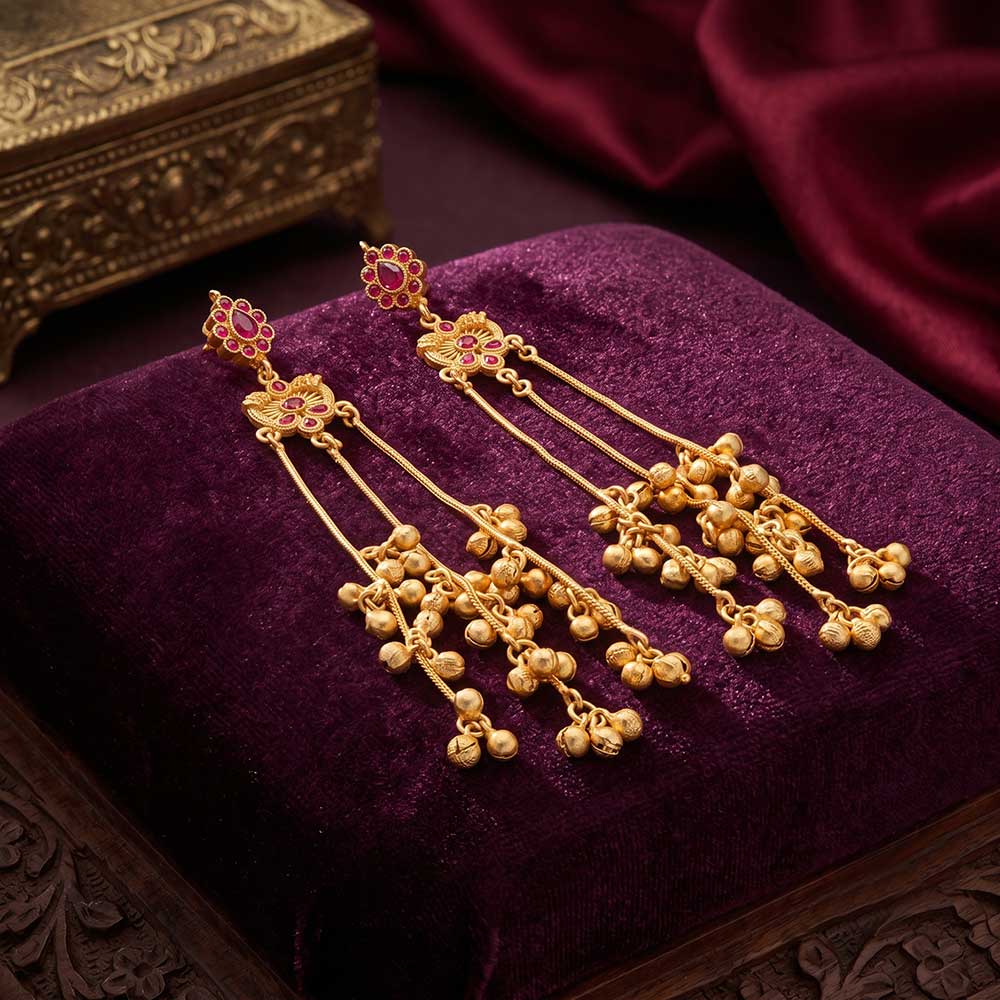 Side angle of the DI gold plated Jhumka earrings showcasing the length and dangling bell design