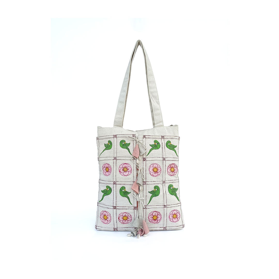 Tote bag with green lizard and flower pattern on a white background