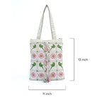 Tote bag with green parrot and pink flower pattern, dimensions indicated.
