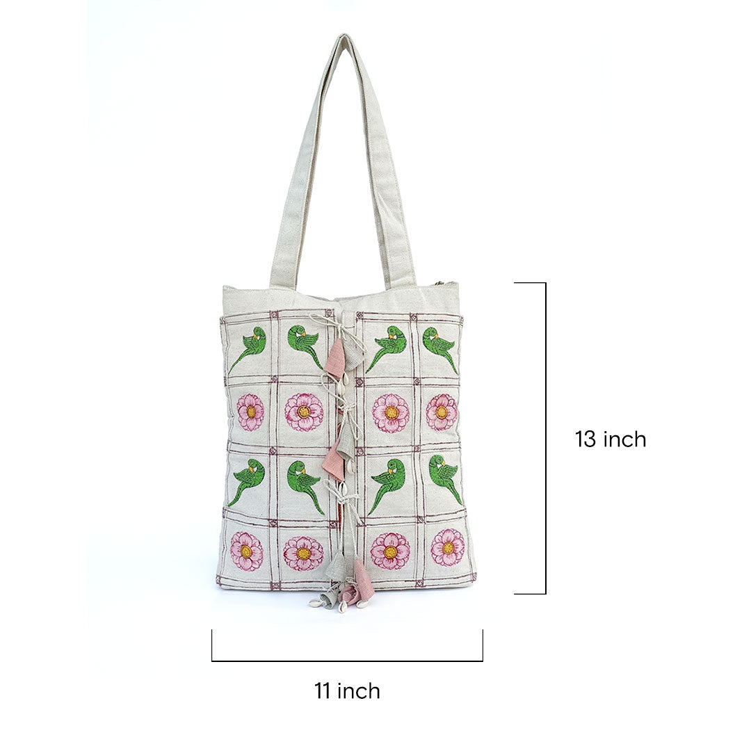 Tote bag with green parrot and pink flower pattern, dimensions indicated.