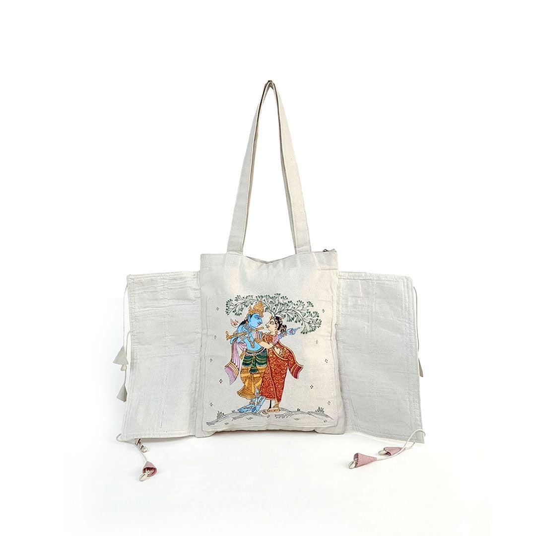 White tote bag with artistic design on a white background