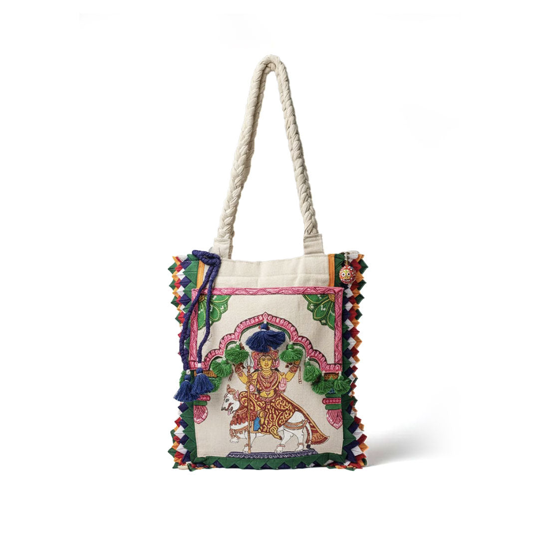 Embroidered bag with colorful designs and a character on a white background