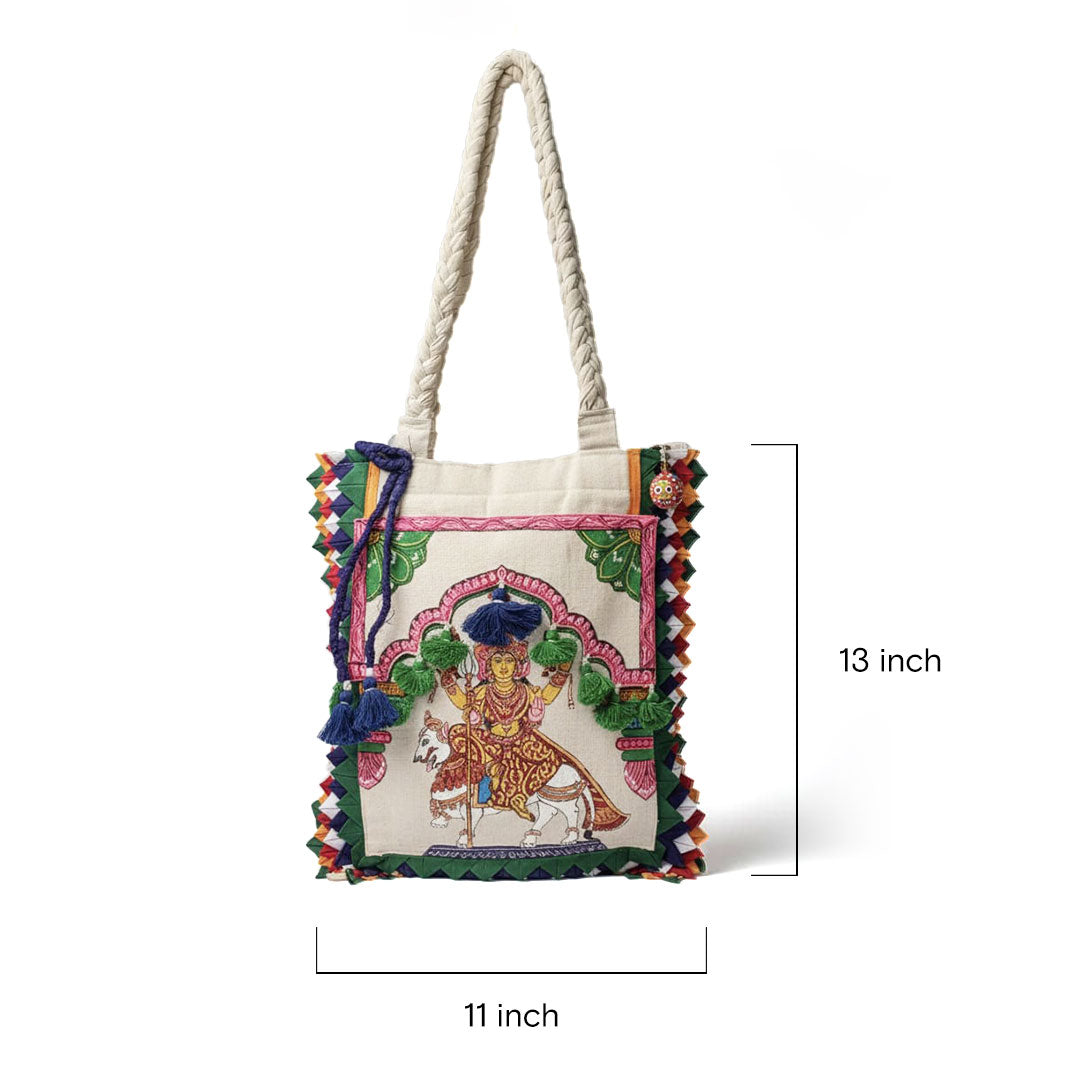 Handbag with colorful design and measurements on a white background