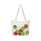 Beige tote bag with circular designs featuring animals on a white background