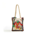 Decorative bag with embroidered design on a white background