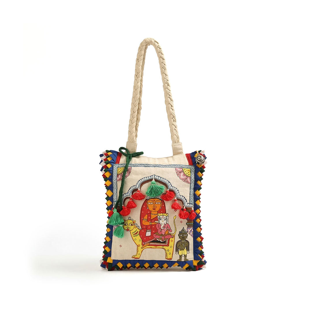 Decorative bag with embroidered design on a white background