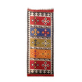 Woven rug with geometric pattern on a white background