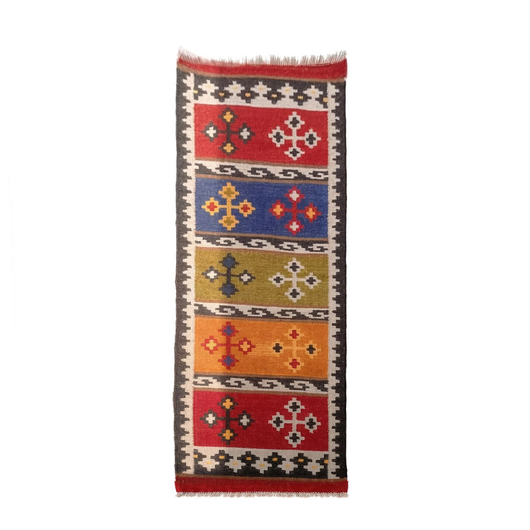 Woven rug with geometric pattern on a white background
