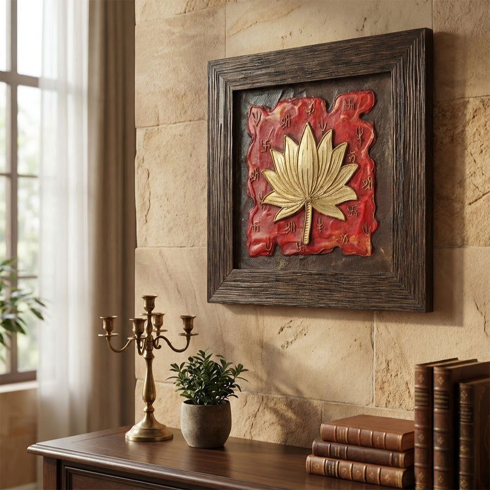 Close-up detail of the embossed golden lotus and textured red stone surface of the handcrafted wall art.