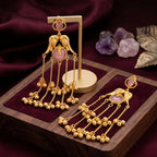 Side angle of elegant gold-plated Jhumka earrings showing the cascading charm layers.