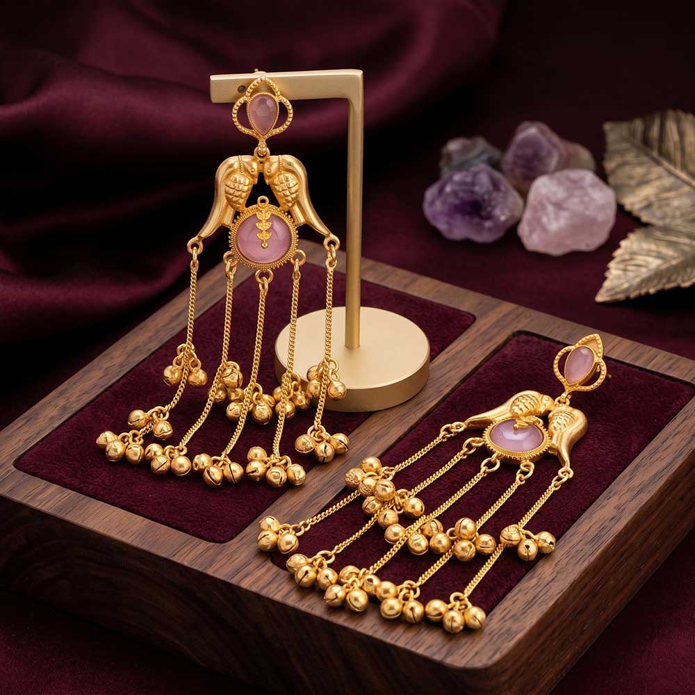 Side angle of elegant gold-plated Jhumka earrings showing the cascading charm layers.