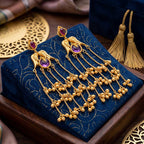 Detailed view of the cascading chain and bell design on the traditional gold plated earrings
