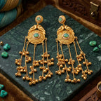 Side angle view of the traditional gold-plated Jhumka earrings showcasing the cascading length.