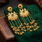 Side angle of elegant traditional peacock jhumka earrings with gold plating