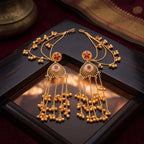 Angled view showcasing the drape of the gold jhumki chains on the traditional ear cuff jewelry.
