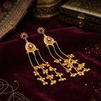 Side angle of the cascading chains and ghungroo design on the gold-plated drop earrings.