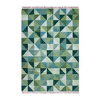 Green geometric patterned rug on a white background