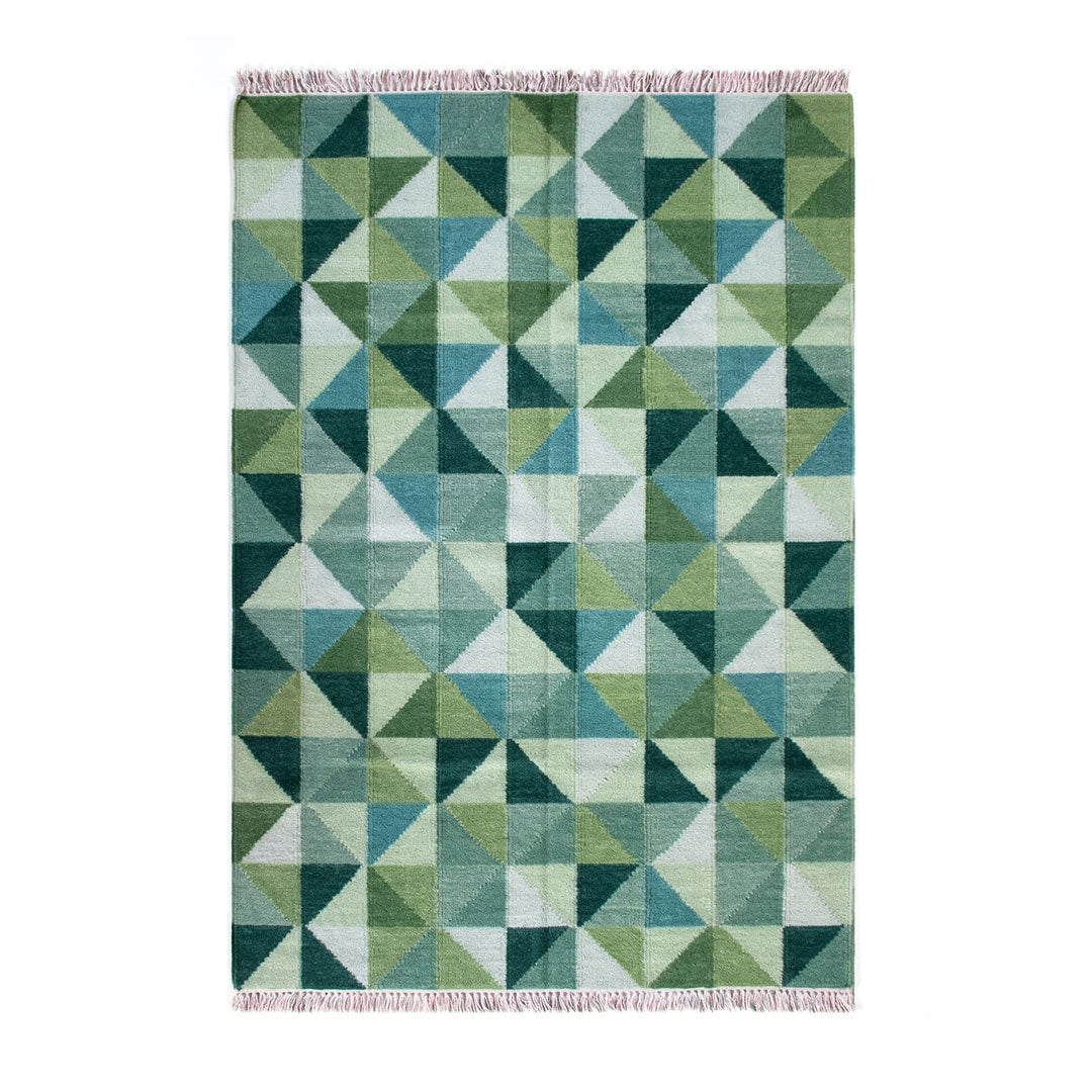 Green geometric patterned rug on a white background