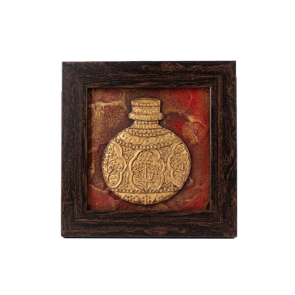 Artisan hand-carved stone painting of a golden vase in a dark wooden frame, front view.
