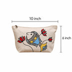 Detailed view of hand-painted blue fish design and stitching on cotton pouch