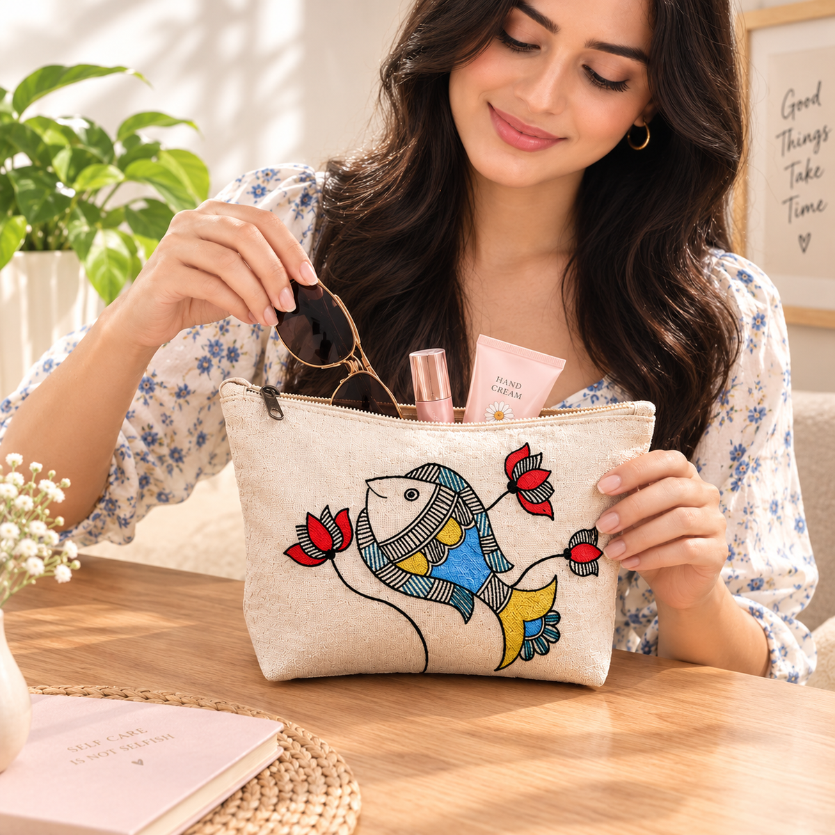 Hand-painted cotton canvas pouch in use storing everyday makeup and accessories