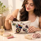 Detailed side angle of the hand-painted cotton pouch showing the zipper and fabric texture.