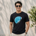 Detail view of the hand-painted planet artwork on the black cotton T-shirt.