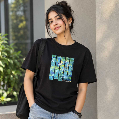Close-up detail of the hand-painted abstract art on the black cotton T-shirt.