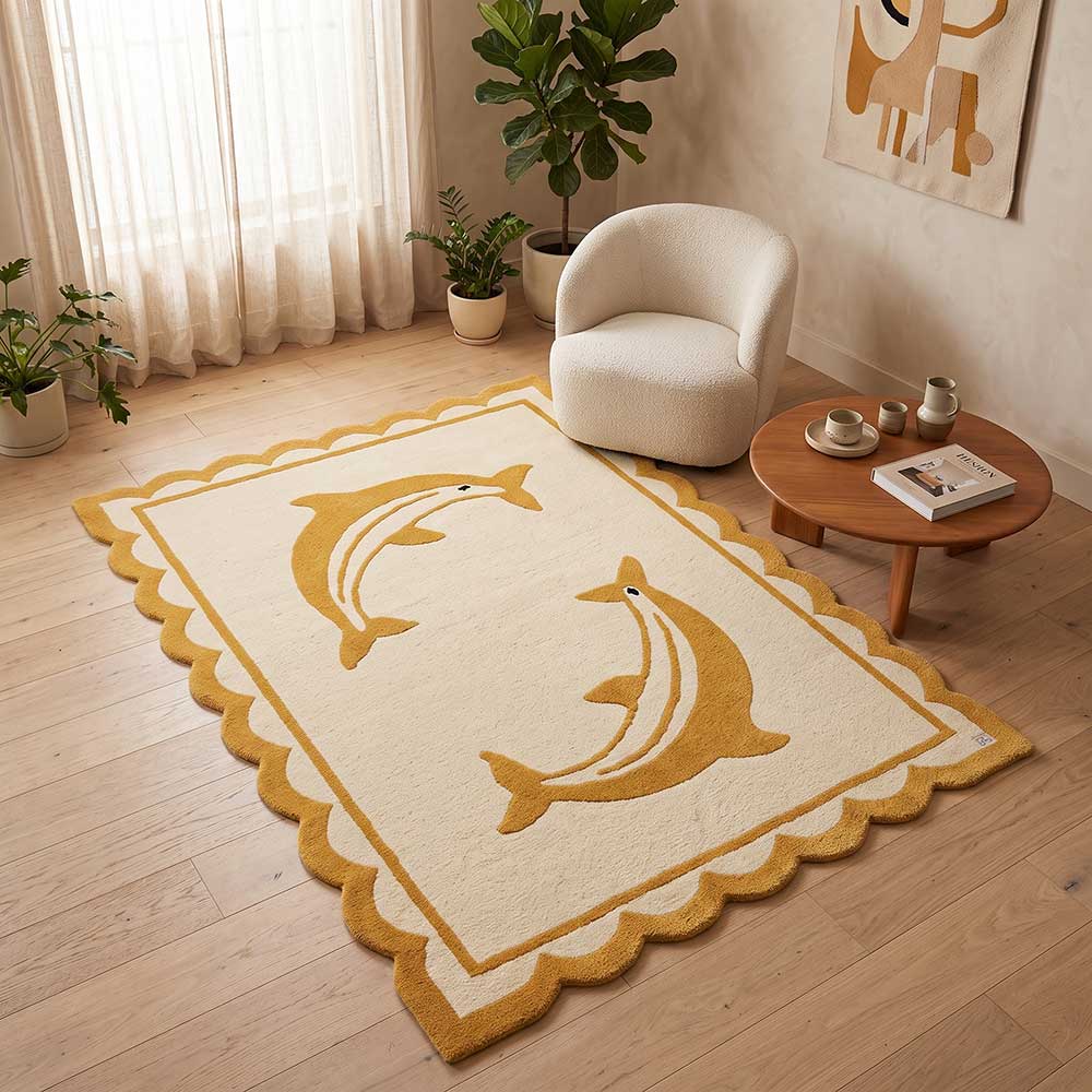 Angled view showing the depth and density of the hand-tufted dolphin design on the premium New Zealand wool rug.