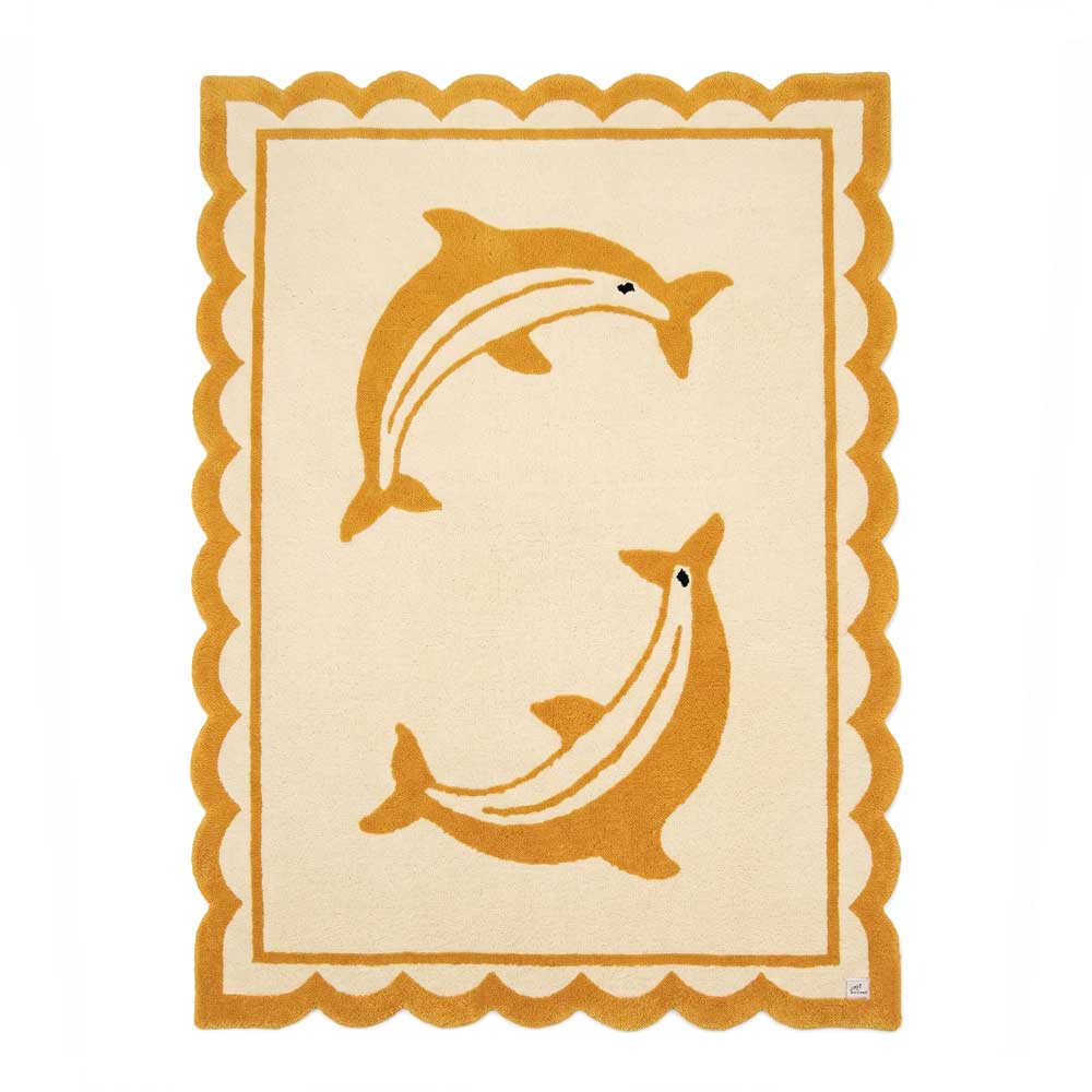 Full top-down view of a rectangular beige hand-tufted New Zealand wool area rug with two yellow dolphins and a yellow scalloped border.