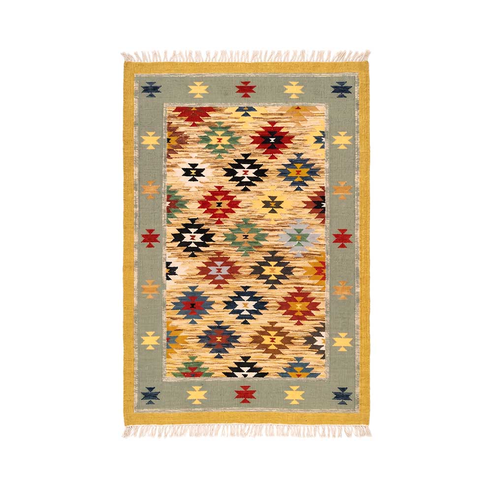 Front view of an artisanal hand-woven Mirzapur Kilim rug featuring a vibrant geometric tribal pattern and a sage green border.