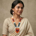 Detailed view of matching multi-color seed bead fringe dangle earrings with French wire hooks