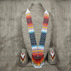Close-up of cascading ombre bead fringe tassel on the bottom of the handcrafted necklace
