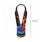 Detail view of the floral beadwork and fringe on the handcrafted beaded necklace.