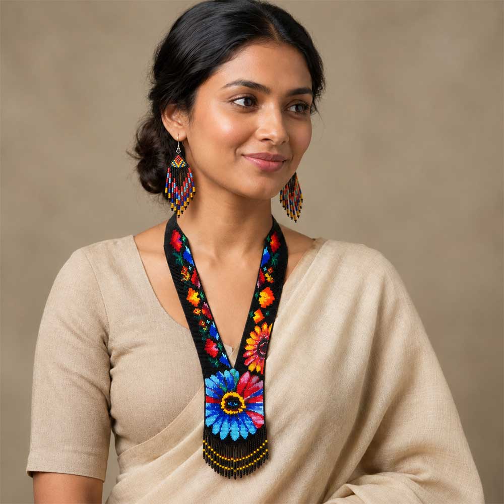 Close-up of the beaded collar and floral pattern on the artisan statement necklace.