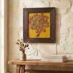 Detail view of the hand-sculpted floral tree and textured gold surface on the stone painting