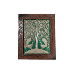 Front view of a handcrafted embossed stone painting featuring peacocks and a tree of life in an ornate wooden frame.