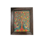 Front view of a rectangular handcrafted stone painting featuring a colorful peacock and Tree of Life relief design in a rustic dark wooden frame.