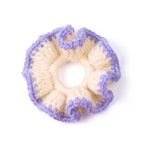 Single handmade cream crochet hair scrunchie with lavender scalloped border isolated on white background