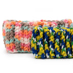Angled view showing the thickness and ribbed construction of the two handmade headbands.