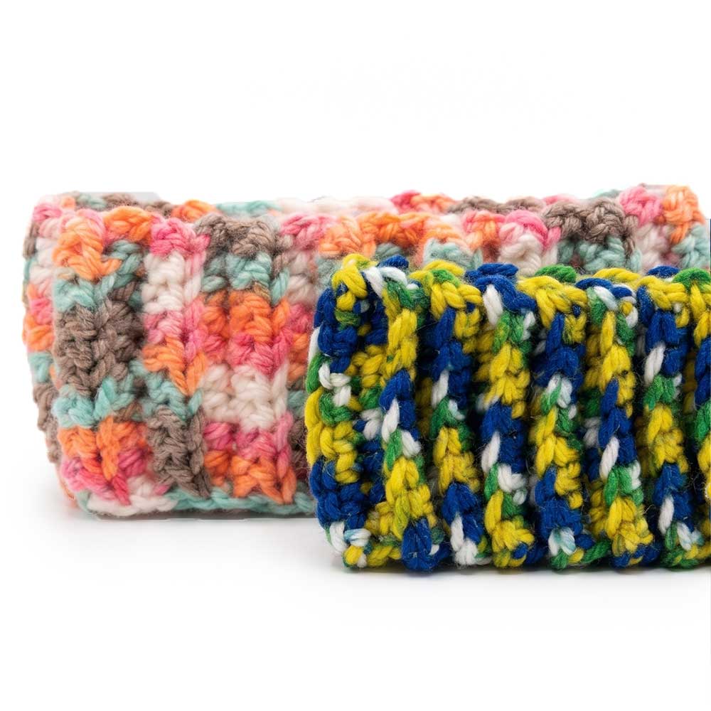 Angled view showing the thickness and ribbed construction of the two handmade headbands.