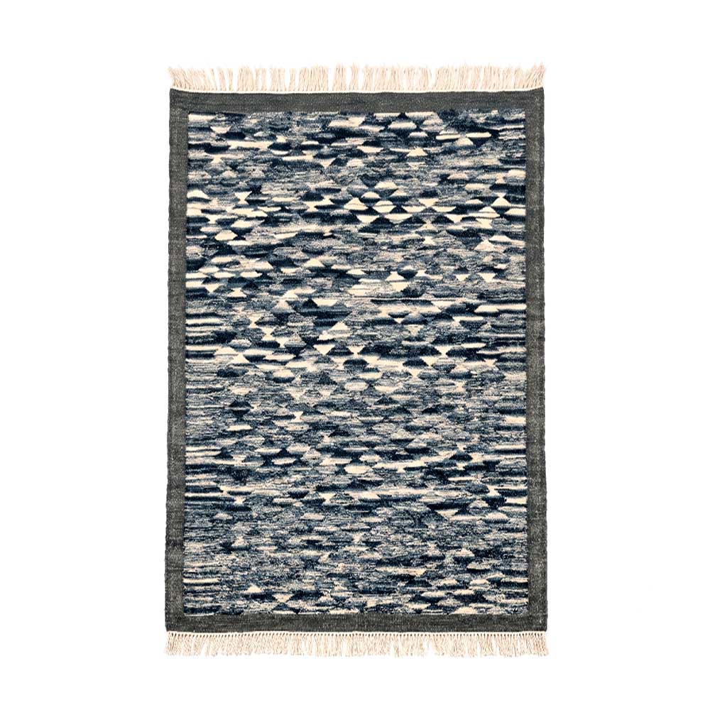 Handwoven Mirzapur geometric wool area rug in navy and cream with tassel details, front view.