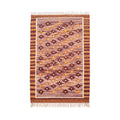 Front view of a rectangular Mirzapur Kilim wool rug featuring a geometric pattern in earthy tones of plum and terracotta with fringed edges.