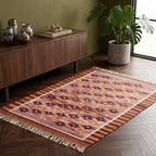Angle view showcasing the weave quality and color depth of the Mirzapur Kilim rug.