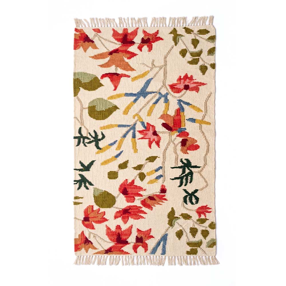 Mirzapur Carpets hand-tufted wool area rug featuring vibrant red, green, and blue floral motifs on a cream background with fringe ends.