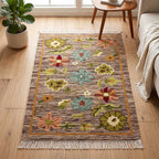 Mirzapur handwoven floral wool area rug styled in modern living room setting